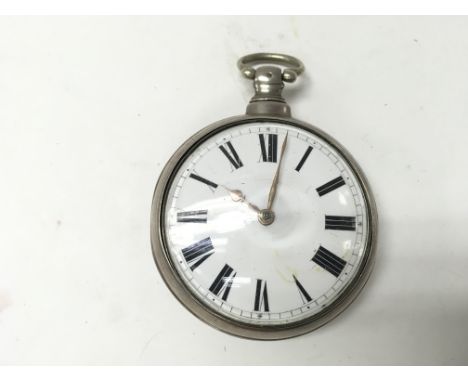 A silver pair cased pocket watch. 55mm case diameter. 151.39g Postage A