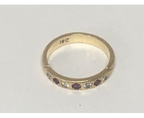 An 18carat gold ring set with alternating ruby and diamonds weight 3.5g ring size M-N
