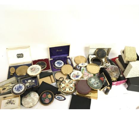 A large collection of compact mirrors including musical examples, this lot cannot be posted