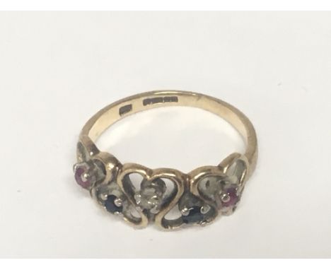 A 9carat gold ring set with a pattern of small ruby sapphire and diamond.