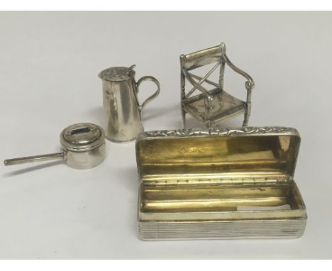 A silver snuff box Birmingham hallmarks early 19th century a miniature silver chair Birmingham 1913 hallmarks a miniature coo