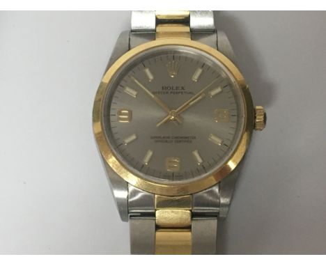 A Gents Rolex stainless steel and gold Oyster Perpetual Superlative Chronometer the silver chrome dial with raised batten and