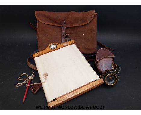 A leather cased WWI (1918) marching compass together with an Aston & Mander 1909 map board in canvas case