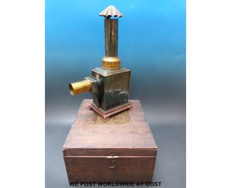 An Ernest Plank magic lantern from 1900 together with box and slides, includes a mechanical example