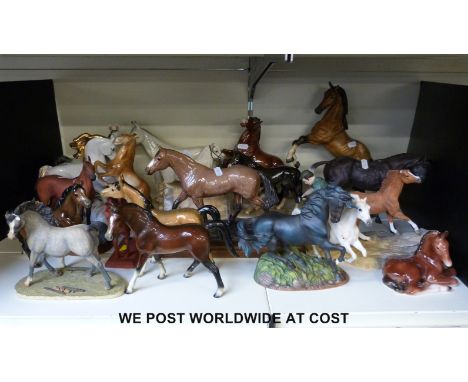 A collection of nineteen various ceramic horses to include Wade, Border Fine Arts, Goebel, Franklin Mint, etc. 