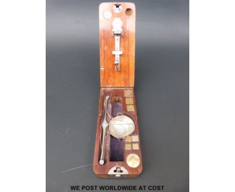 A cased set of Calipe Dettmer & Co travelling diamond scales with fold out mechanism, weights inside and tweezers to rear 
