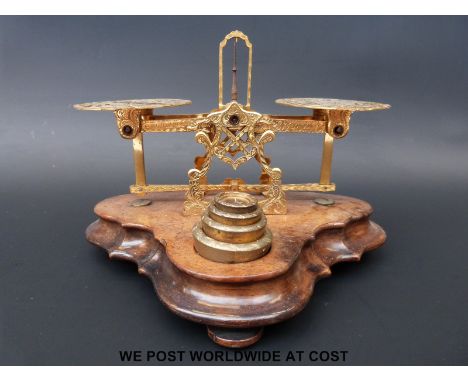 A set of S.Mordan & Co. gilt and pierced postage scales with weights to front the pans having flags commemorating the 1853 Cr