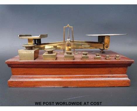 A probably Ratcliff set of postage scales with square tapering weights to front 