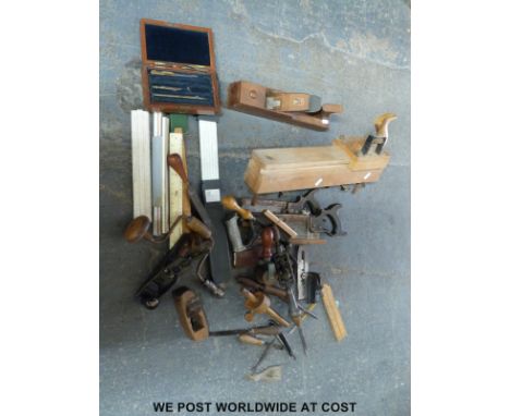 A quantity of woodworking tools including a small unnamed plane, slide rules etc, Dryad paper plane etc