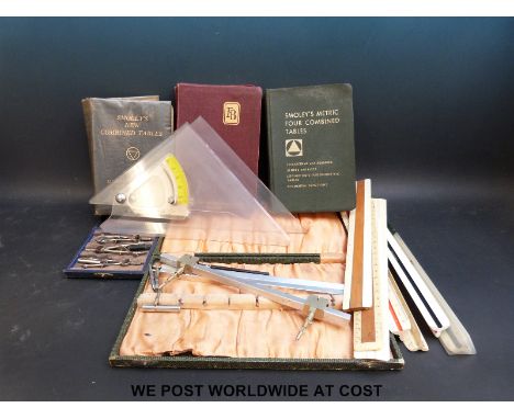 A quantity of draughtsman's and similar equipment including beam compass, Smoley's tables etc 