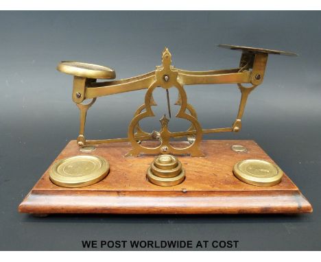A late 19thC set of brass table top postal scales 