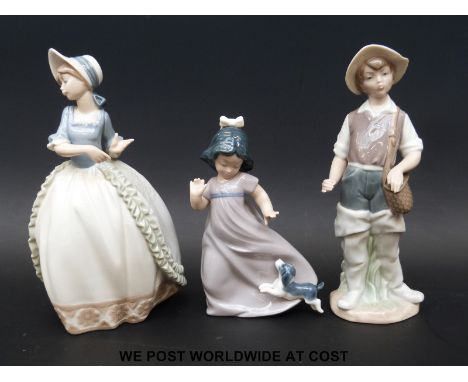 A Lladro "Countryman" together with a Nao shepherdess and a Nao girl with puppy