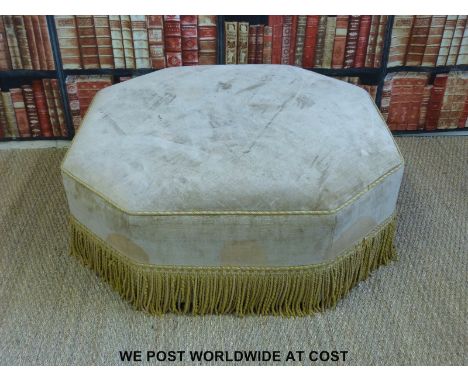 A large octagonal upholstered pouffe with fringed edge (H40 x W 106 x D106cm)