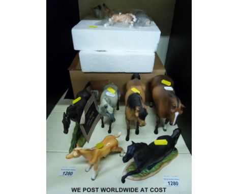 A collection of resin and ceramic horses including a boxed Wade North Light horse and foal 