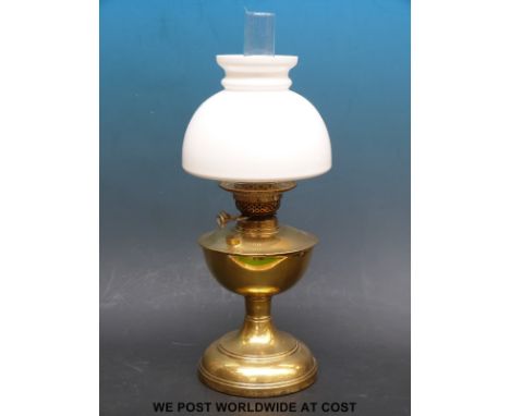 A brass twin burner oil lamp