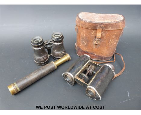 A cased pair of cWWI binoculars by Goertz, Berlin, army and navy binoculars and a small brass telescope