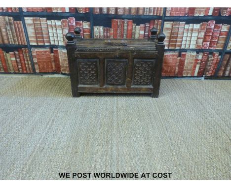 An Eastern panelled storage trunk with hinged top and carved decoration (H50 x W67 x D39cm)
