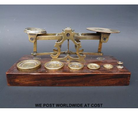 A Mordan set of postage scales with weights to base including two weights marked F (pre 1851) 
