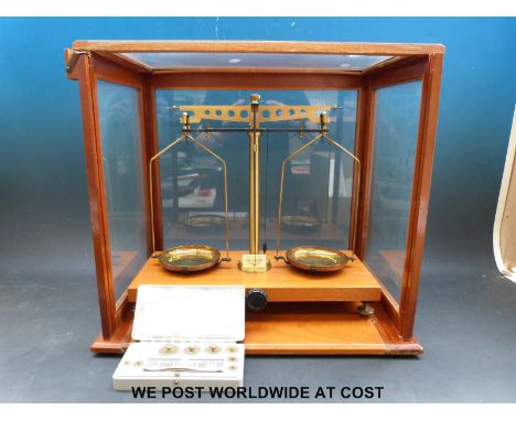 A cased set of Gallenkamp laboratory scales and a box of weights