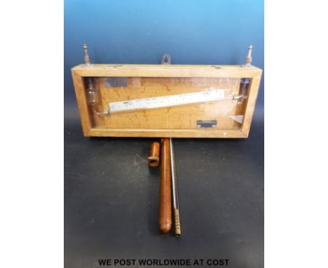 A Negretti & Zambra liquid gauge together with a brass thermometer in a wooden case
