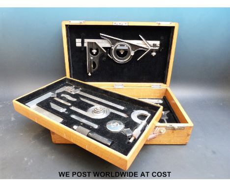 A wooden cased set of precision tools on two drawers marked Starrett & Co to the tools