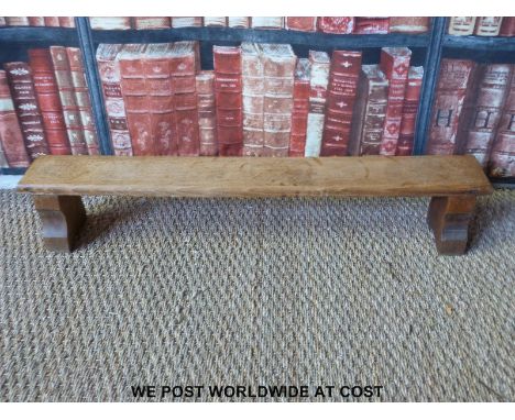 A small Arts and Crafts oak child's bench or step (H16 x L86 x D12)