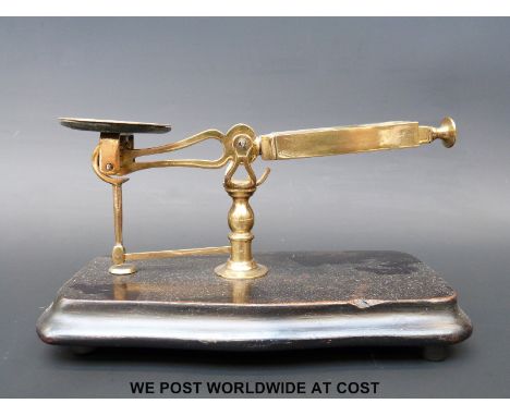 A Perry & Co, London half roberval postage scale on ebonised base with slide out weight 