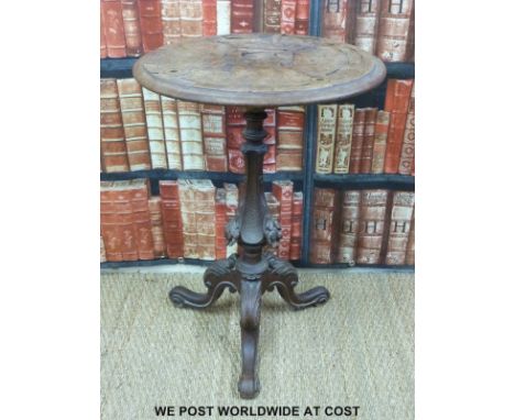 A carved Victorian tripod table (H75 x Diameter 52cm)