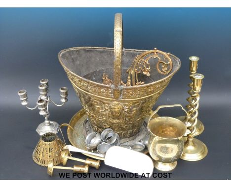 A quantity of brass and other metalware to include coal scuttle, hollow twist candlestick, candelabra, hammered pewter etc