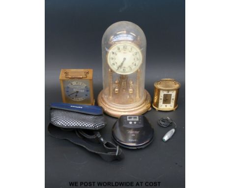 A Swiza oval eight-day carriage clock together with an Ernst Jones quartz example, a Kundo anniversary clock and a personal C