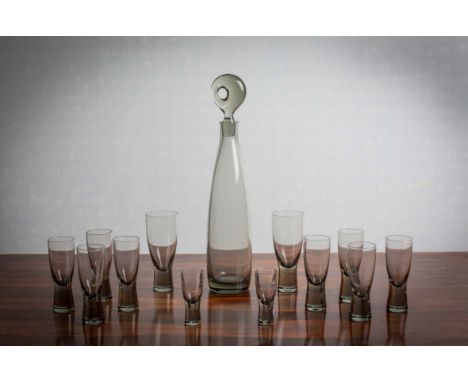 A SUITE OF GLASSWARE BY KASTRUP-HOLMEGARD, DENMARK, comprising a decanter and stopper and 12 drinking glasses (various sizes)