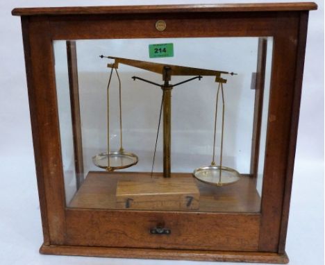 Gilt brass laboratory scales and weights by Philip Harris & Co, Birmingham in a glazed case. 17½'' wide