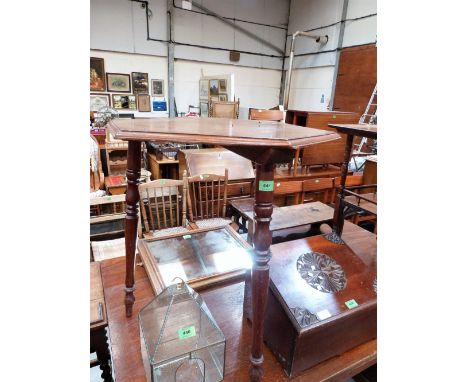 A 19th century walnut hexagonal centre table on turned tripod supports. 23'' diameter