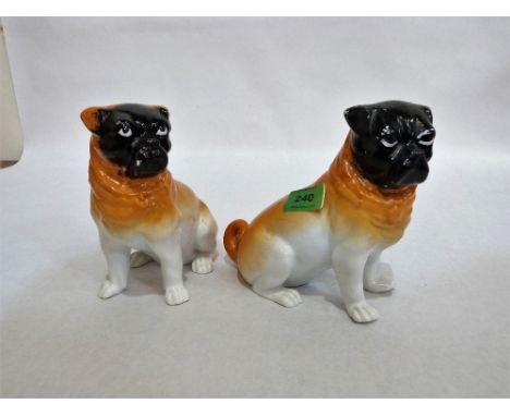 A pair of 19th century ceramic pug dogs. 6¼'' high