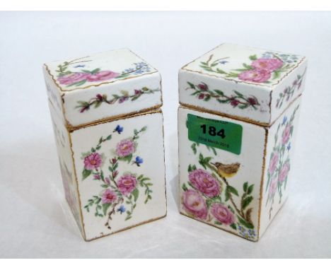 A pair of continental ceramic boxes and covers, painted in colours with flowers and birds. 4½'' high