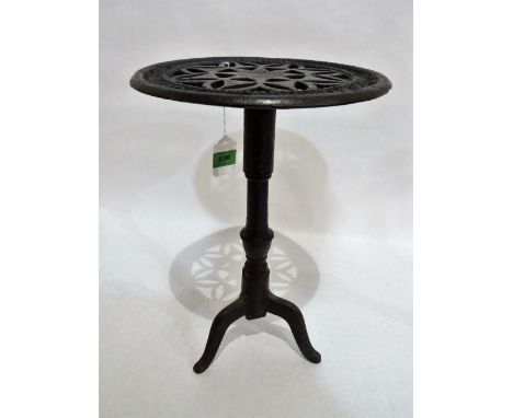 An 18th century cast iron kettle stand, the pierced geometric top with impressed maker's mark WB. Hock & Co; on tripod suppor