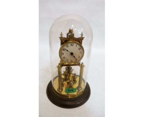A brass anniversary clock under a glass dome. 11½'' high