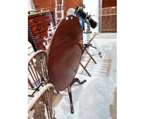 A mahogany tripod table with round snap top. 35'' diameter