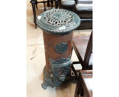 A French Godin cast iron and vitreous enamel stove