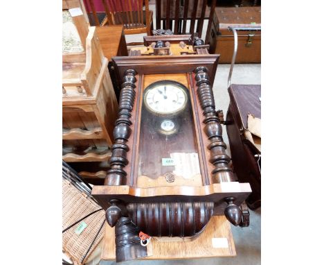 A Vienna style walnut cased wall clock with two train movement. 33'' high