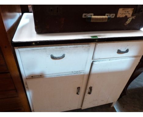 A 1950's kitchen cabinet with enamel top. 34'' wide