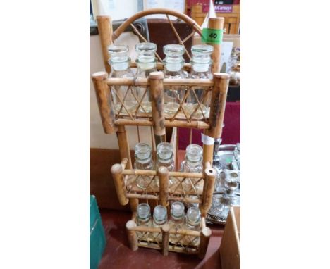 A bamboo spice rack with glass jars