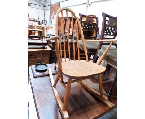 A stick back rocking chair. Probably Ercol