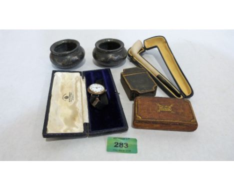 A George III toleware snuffbox; another example in treen; a cased clay pipe, a silver lady's wristwatch and a pair of Bidri s