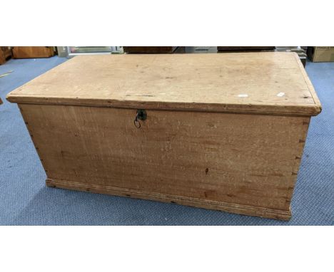 A Victorian pine trunk with key and having wrought iron handles 42cm h x 96cm w Location: 