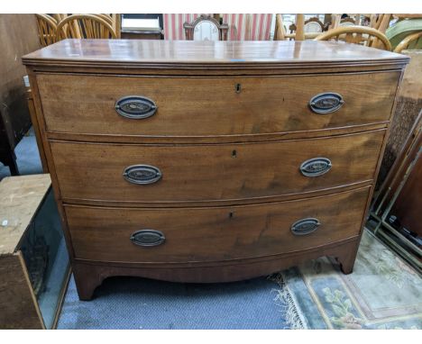 An early 19th century mahogany bow fronted commode chest of three drawers on bracket shaped feet 84cm h x 107cm w Location: 