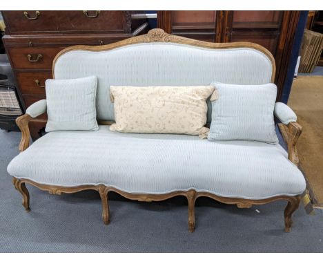 A late 19th/early 20th century beech sofa having a carved frame and on cabriole legs plus 3 loose cushions 100cm h x 168cm w 