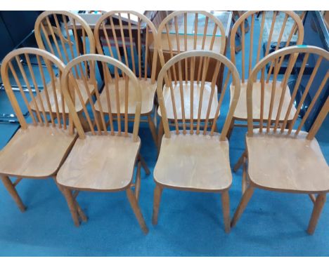 A set of eight Ercol inspired elm and beech stick back chairsLocation: 