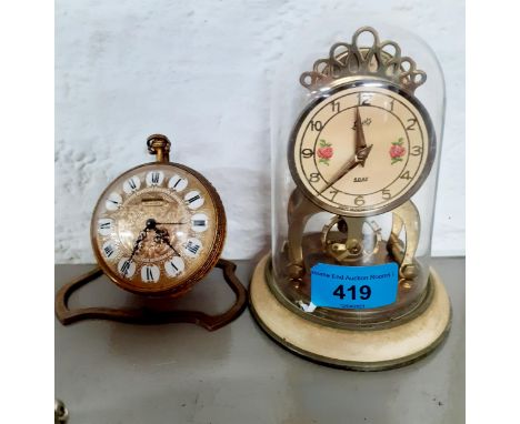 Two mod 20th century bedside clocks to include an Anniversary clock under dome and a Ernest Borel pocket watch style clockLoc
