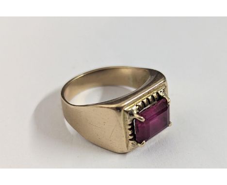 A yellow metal signet ring inset with central ruby, 5.7gLocation: RING 